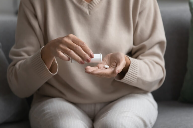Woman taking a pill