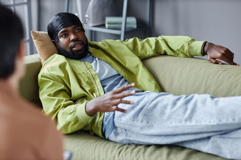 ADHD Therapy 12 Image of man on couch talking to a behavioral therapist