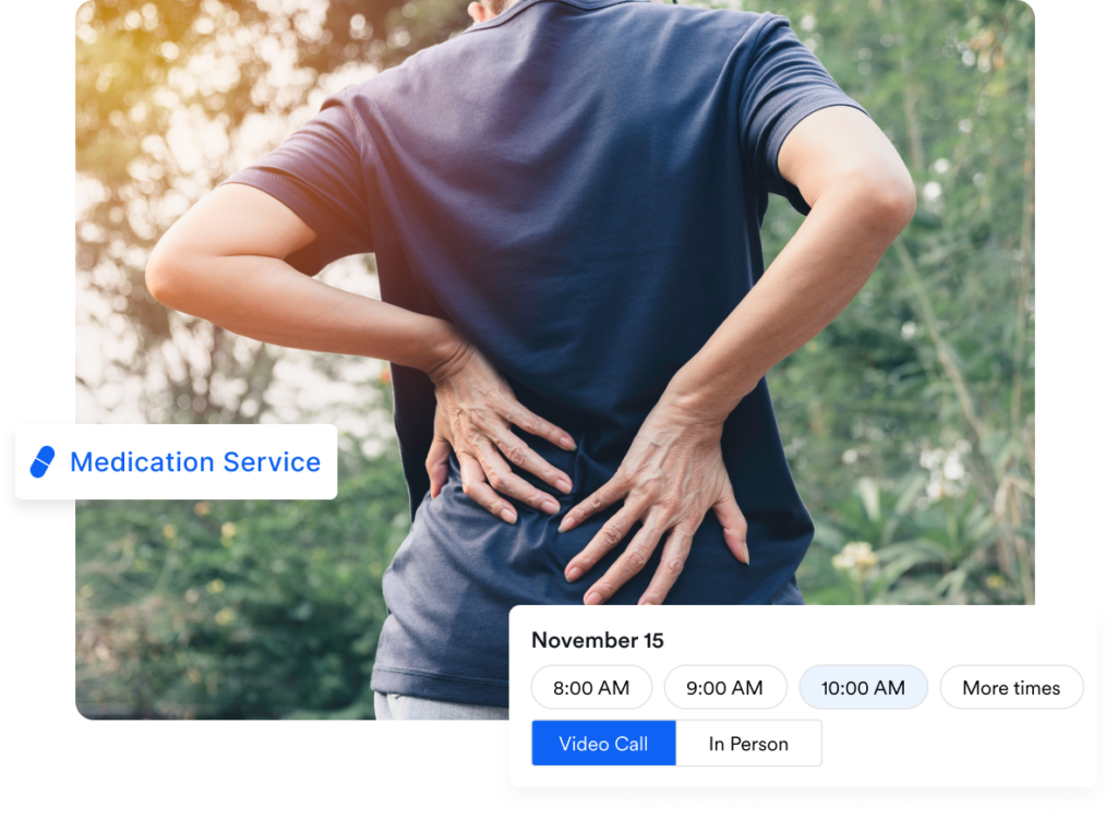 Woman grasping lower back in need of back pain treatment